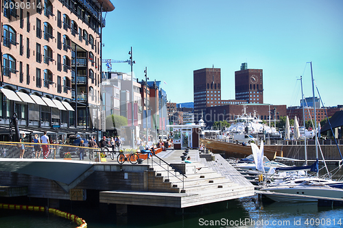 Image of OSLO, NORWAY – AUGUST 17, 2016: People walking on modern distr