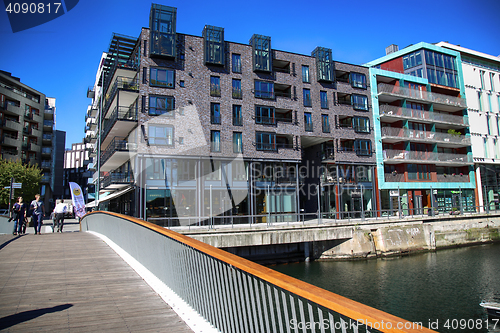 Image of OSLO, NORWAY – AUGUST 17, 2016: People walking on modern distr