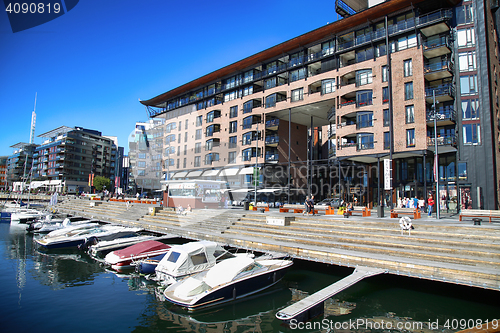 Image of OSLO, NORWAY – AUGUST 17, 2016: People walking on modern distr