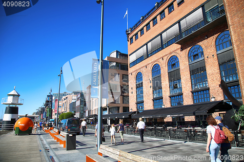 Image of OSLO, NORWAY – AUGUST 17, 2016: People walking on modern distr