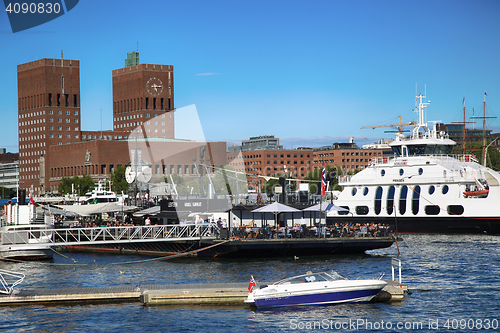 Image of OSLO, NORWAY – AUGUST 17, 2016: People walking on modern distr