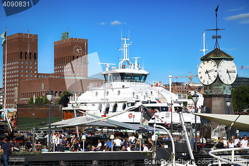 Image of OSLO, NORWAY – AUGUST 17, 2016: People walking on modern distr