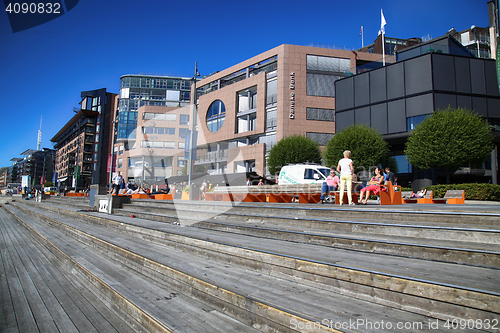 Image of OSLO, NORWAY – AUGUST 17, 2016: People walking on modern distr