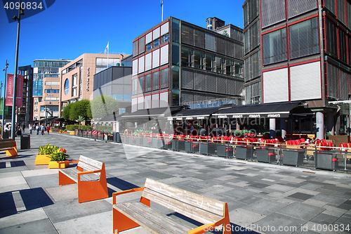 Image of OSLO, NORWAY – AUGUST 17, 2016: People walking on modern distr