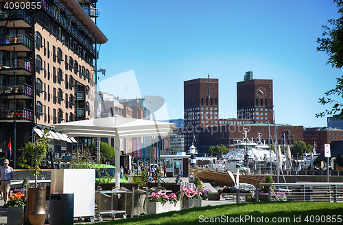 Image of OSLO, NORWAY – AUGUST 17, 2016: People walking on modern distr