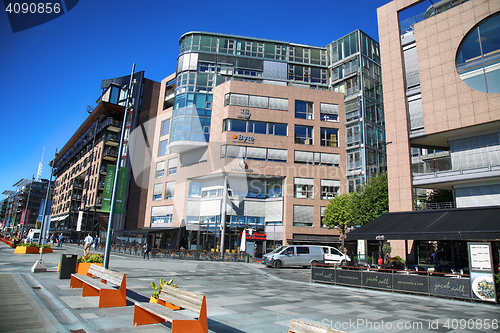 Image of OSLO, NORWAY – AUGUST 17, 2016: People walking on modern distr