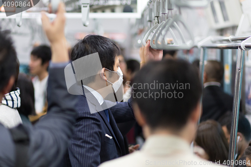 Image of Passengers traveling by Tokyo metro.