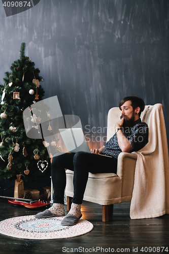 Image of Hipster surfing the web. 