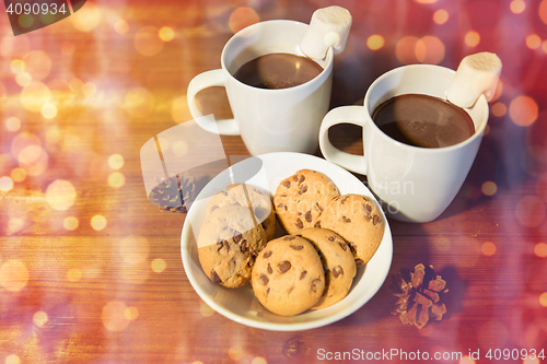 Image of cups of hot chocolate with marshmallow and cookies