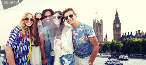 Image of happy hippie friends with selfie stick at coliseum