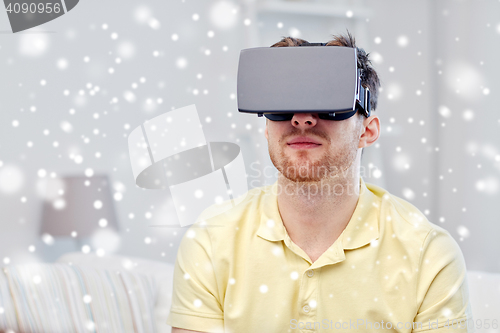 Image of young man in virtual reality headset or 3d glasses