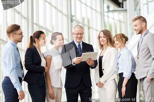 Image of business people with tablet pc computer at office