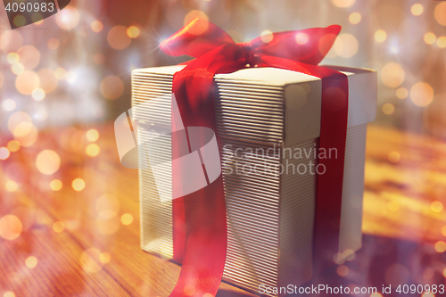 Image of close up of christmas gift box on wooden table