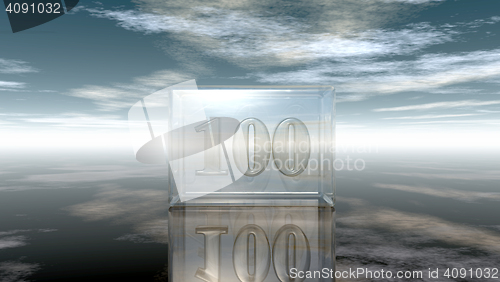 Image of number one hundred in glass cube under cloudy sky - 3d rendering