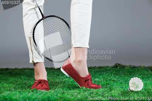 Image of Woman\'s Legs And Badminton Racket