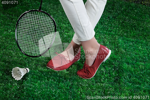 Image of Woman\'s Legs And Badminton Racket