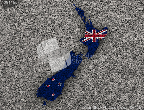 Image of Map and flag of New Zealand on poppy seeds,