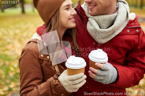Image of close up of happy couple with coffee in autumn
