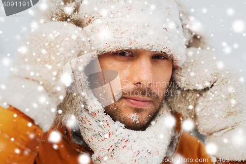 Image of face of man in winter clothes outdoors