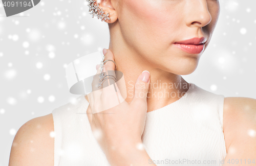 Image of close up of beautiful woman with ring and earring