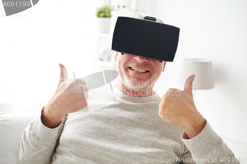 Image of old man in virtual reality headset or glasses