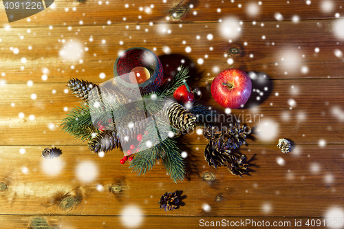Image of christmas fir branch decoration and candle lantern