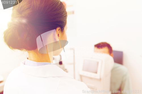 Image of close up of optician and patient at eye clinic