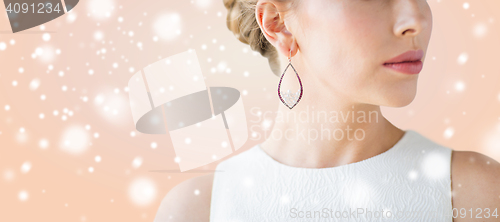 Image of close up of beautiful woman face with earring