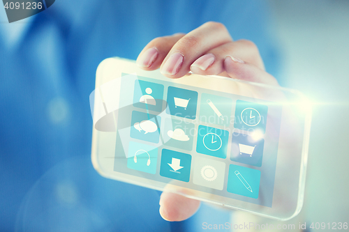 Image of close up of woman with transparent smartphone menu