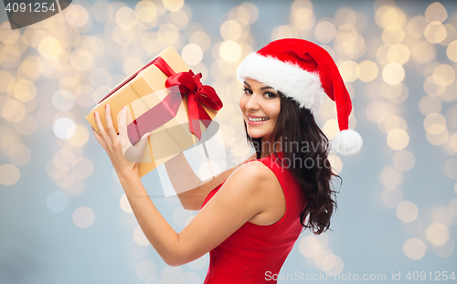 Image of beautiful sexy woman in santa hat with gift box