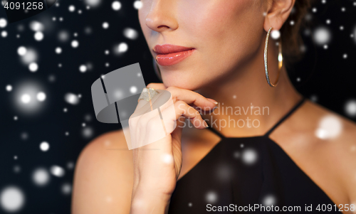 Image of close up of beautiful woman with diamond jewelry