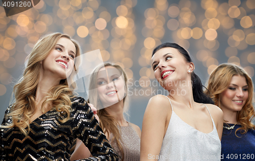 Image of happy young women dancing at holidays party