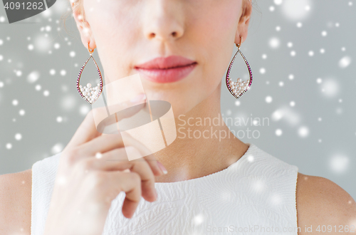 Image of close up of beautiful woman face with earrings