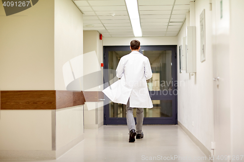 Image of medic or doctor walking along hospital corridor