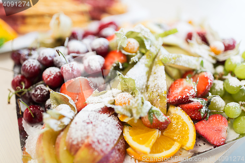 Image of close up of dish with sugared fruit dessert