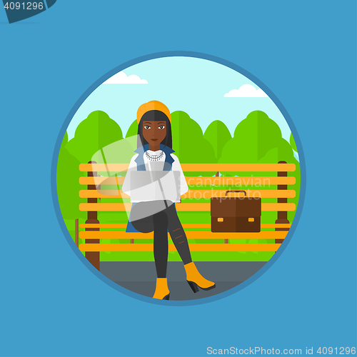 Image of Business woman working on laptop outdoor.