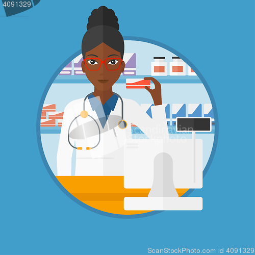 Image of Pharmacist showing some medicine.