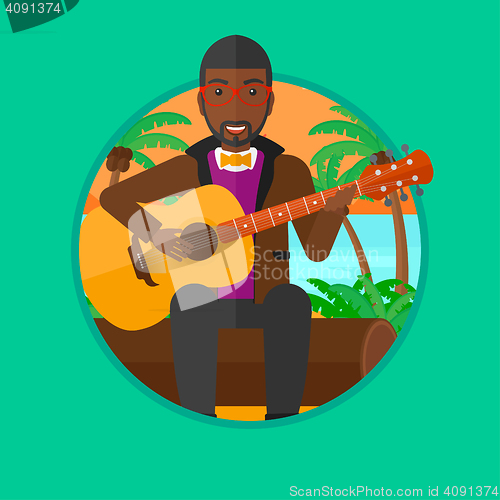 Image of Musician playing acoustic guitar.