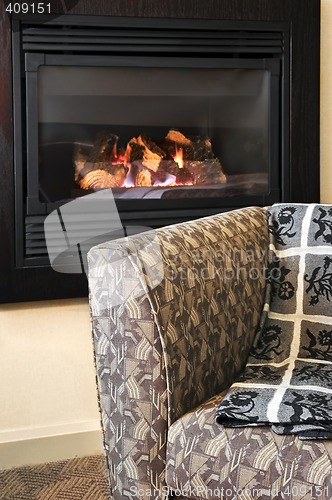 Image of Fireplace and armchair