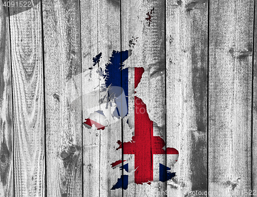 Image of Map and flag of Great Britain on wood,