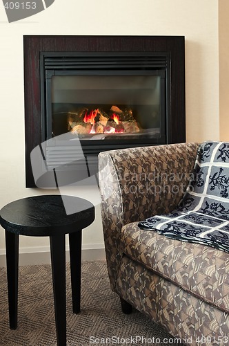 Image of Fireplace and armchair