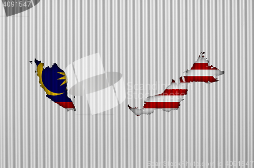 Image of Map and flag of Malaysia on corrugated iron