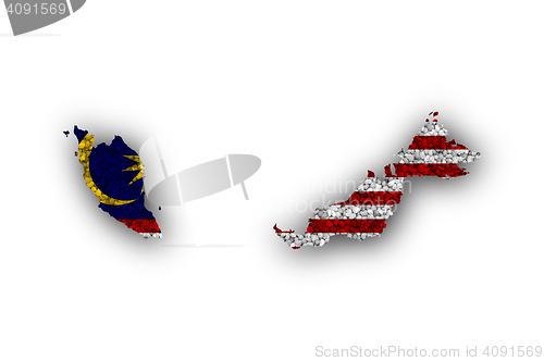 Image of Map and flag of Malaysia on poppy seeds