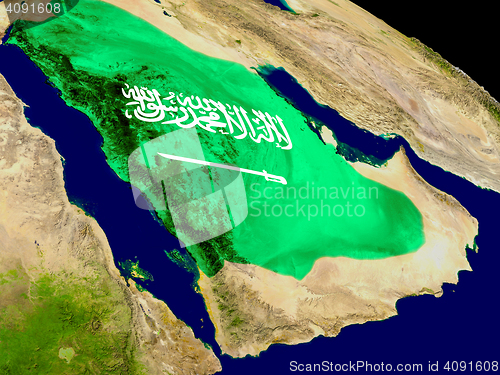 Image of Saudi Arabia with flag on Earth