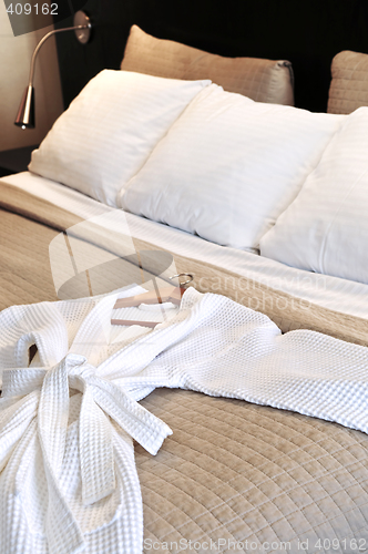 Image of Hotel bed with bathrobe