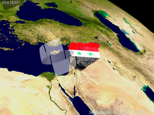 Image of Syria with flag on Earth