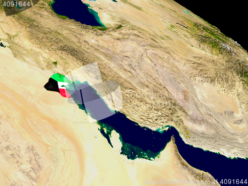 Image of Kuwait with flag on Earth