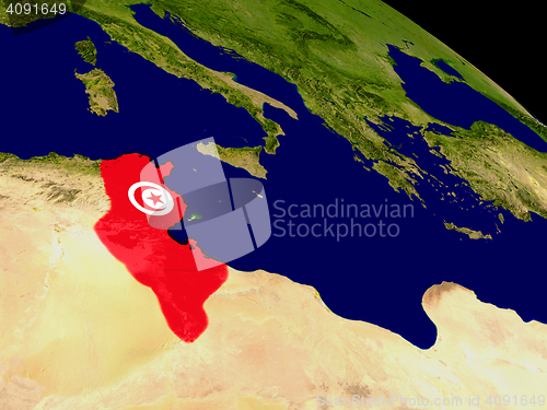 Image of Tunisia with flag on Earth