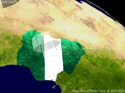 Image of Nigeria with flag on Earth