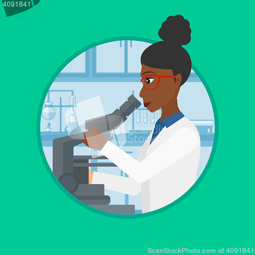 Image of Laboratory assistant with microscope.